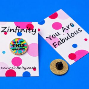 Zinfinity Enamel Pin with "Yes, I'm THIS Fabulous" text on a card with polka dots.