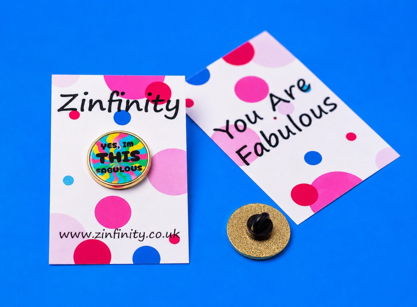 Zinfinity Enamel Pin with "Yes, I'm THIS Fabulous" text on a card with polka dots.