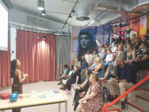 Speaker at Wish I'd Known Connect event addresses seated audience.