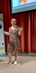 Sarah Griffin speaks at a Connect event, discussing "Wish I'd Known.